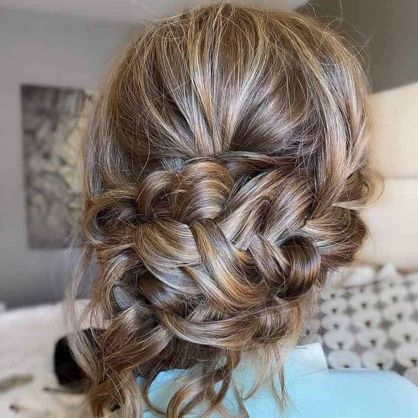 Flowy Braided Bun With Curly Wisps