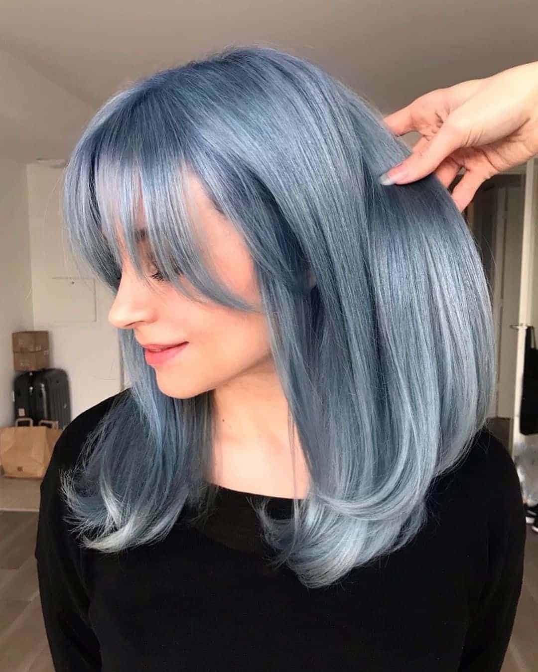 Denim Blue Layered Hair With Curtain Bangs