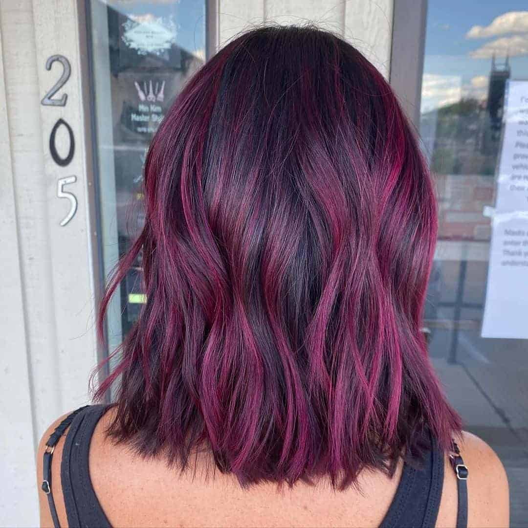 Pop of Pink Highlights in a Choppy Black Bob