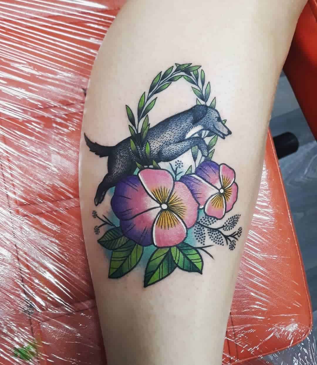 Colorful Jumping Dog and Flowers Tattoo