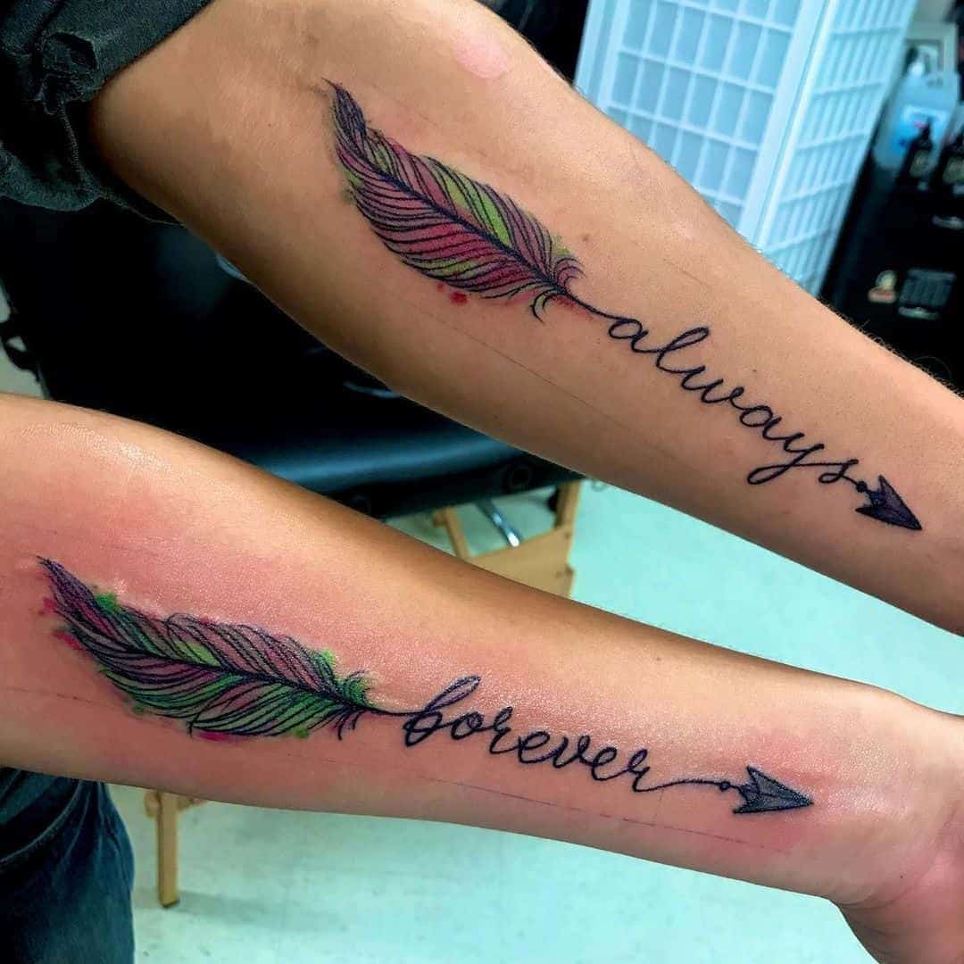 Arrow, Feather, and Inspiring Word Matching Tattoos