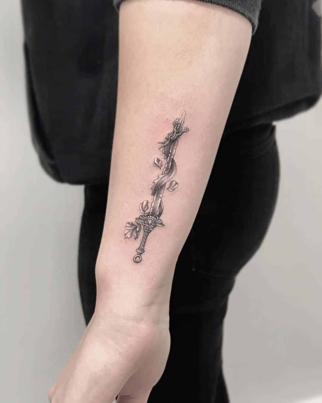 Dragon With Sword Tattoo