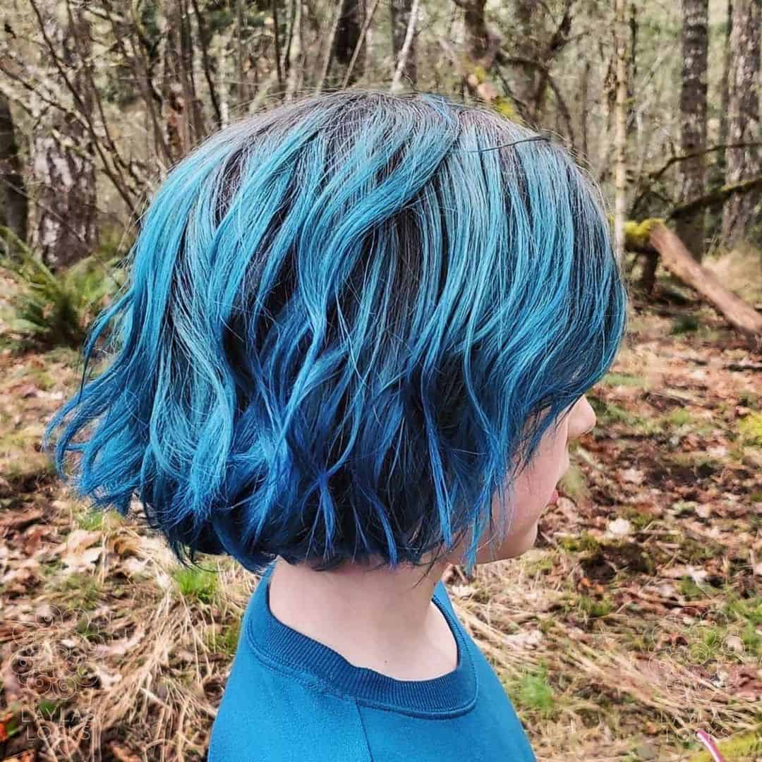 Layered Curls With Mermaid Blue Highlights