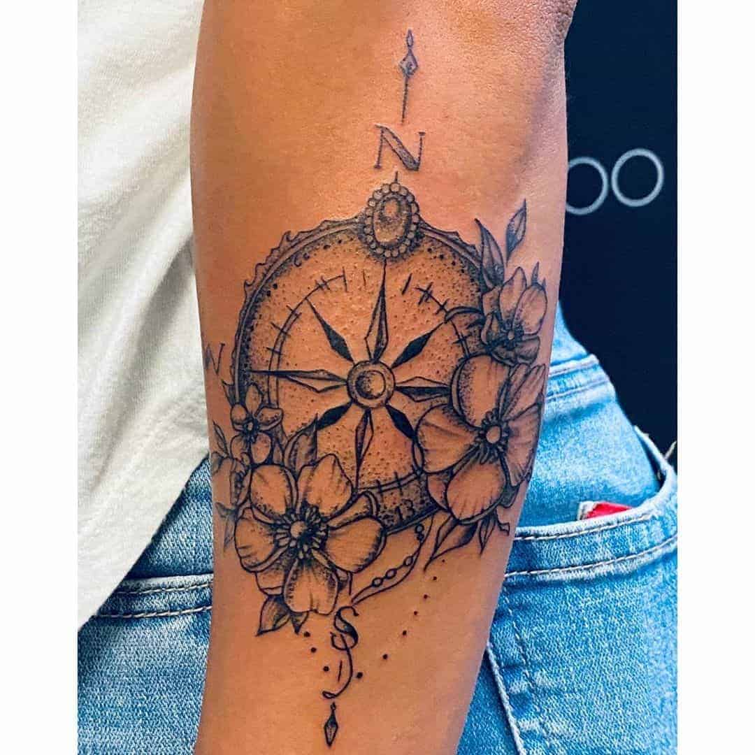 A Compass With Flowers