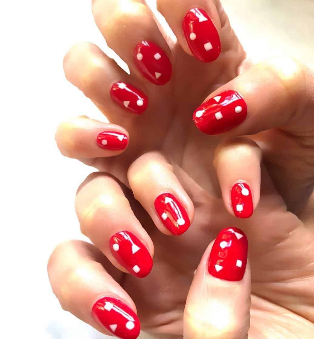 Red Nails With Geometric Shapes