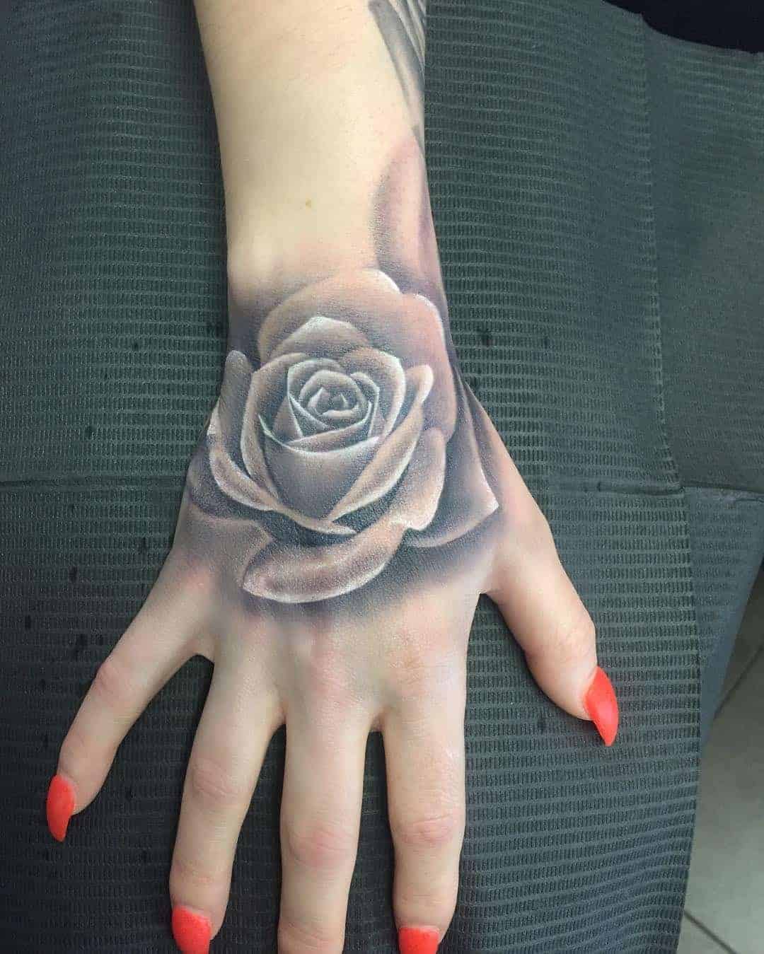 Grayscale Rose Hand Tattoo