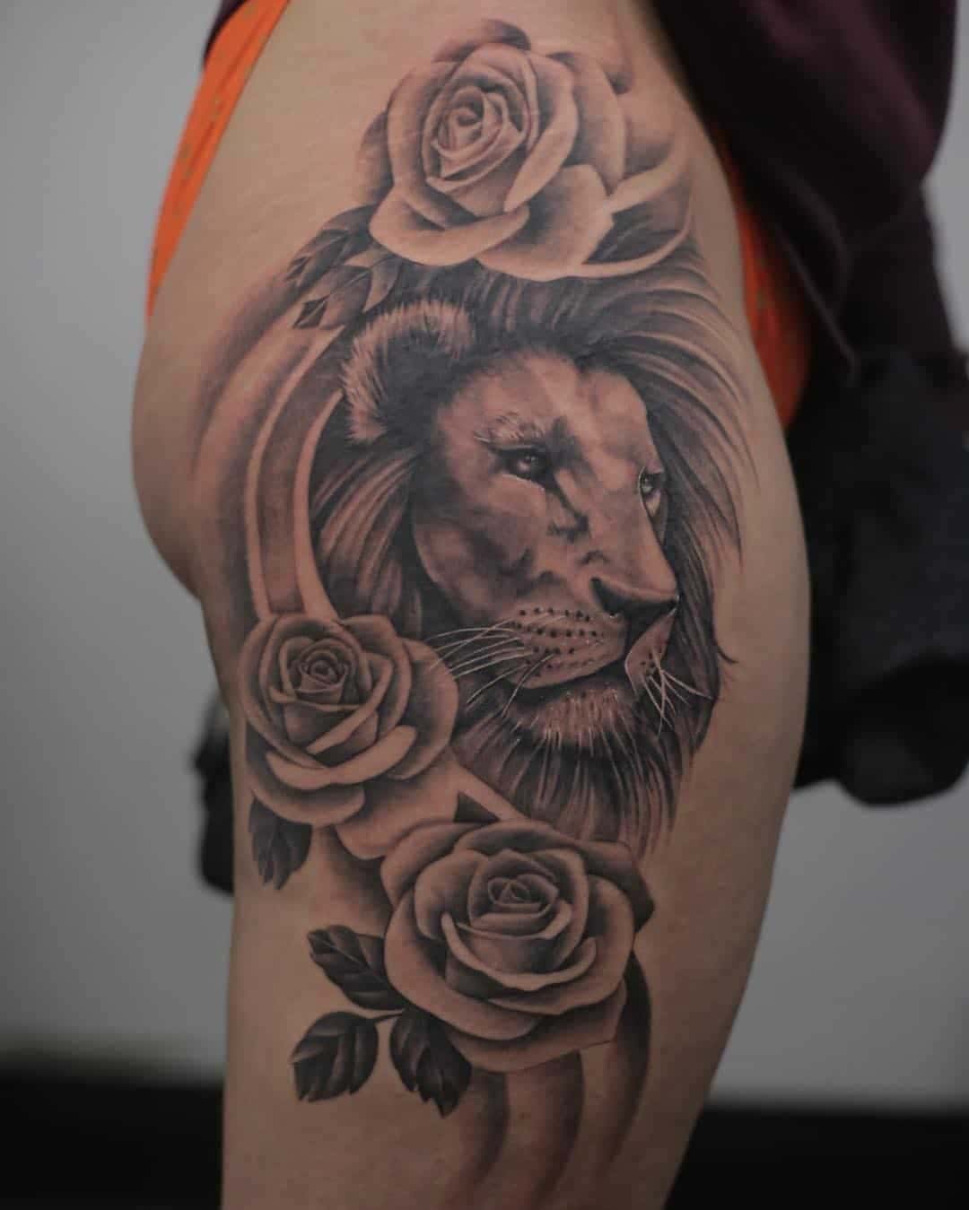 Rose-Flanked Lion Tattoo