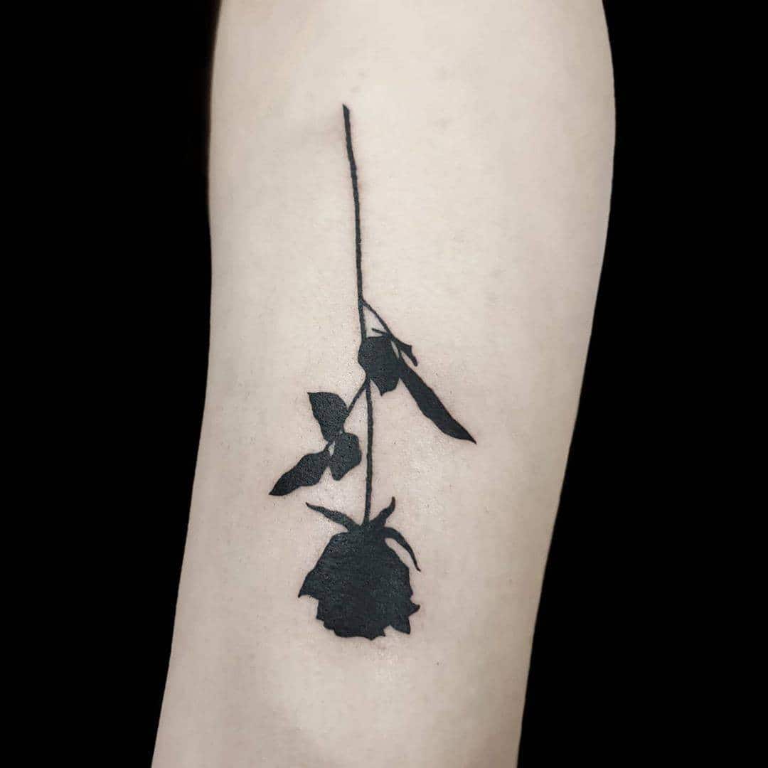 Black Rose Silhouette Tattoo