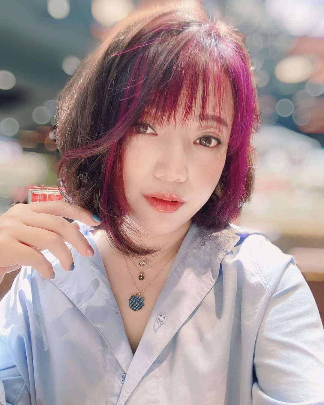 Angled Bob With Plum Highlighted Bangs